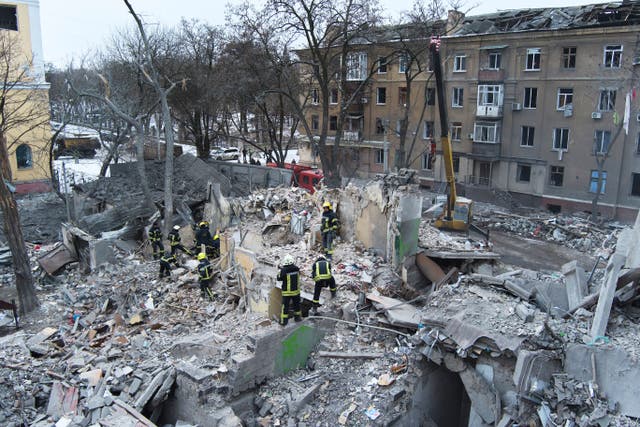 Rescuers work at the scene of an apartment building hit by a Russian rocket in Kramatorsk