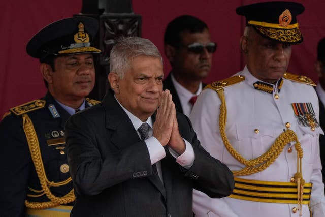 President Ranil Wickremesinghe watches the parade