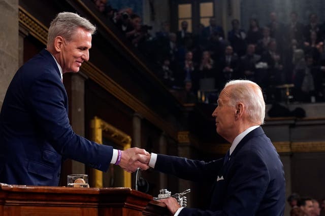 President Joe Biden shakes hands with House Speaker Kevin McCarthy