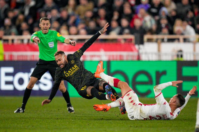 PSG’s Neymar, centre, and Monaco’s Ruben Aguilar fight for the ball 