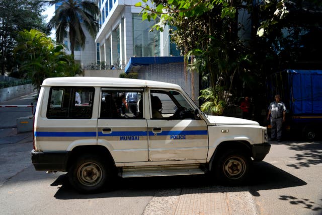 A police vehicle parked at the gate of a building which houses BBC offices in Mumbai, India, on Tuesday