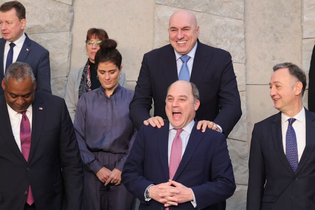 Italy’s defence minister Guido Crosetto, top, jokes with British Defence Secretary Ben Wallace during a group photo of Nato defence ministers at Nato headquarters in Brussels