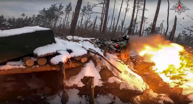 A Russian paratrooper fires a Russian man-portable missile on a mission at an unspecified location in Ukraine 