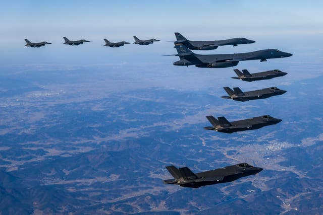 US Air Force B-1B bombers, centre, fly in formation with South Korea’s Air Force F-35A fighter jets, bottom, and U.S. Air Force F-16 fighter jets, top, over the South Korea Peninsula during a joint air drill in South Korea 