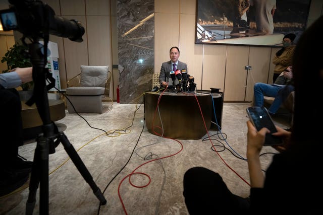 He Jiankui speaks at a brief press conference in Beijing