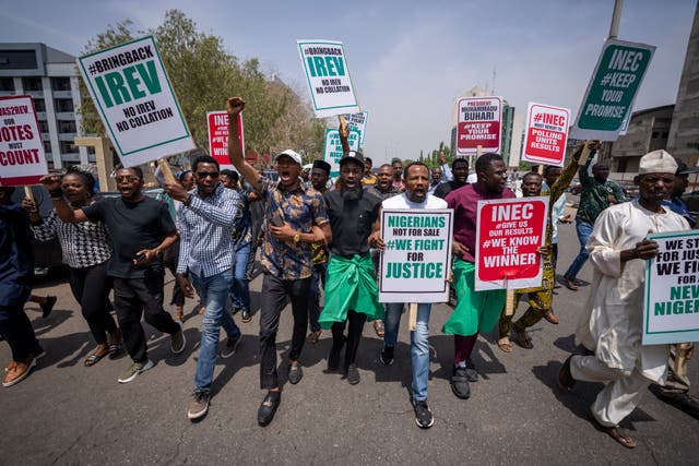 Demonstrators accusing the election commission of irregularities and disenfranchising voters make a protest in Abuja, Nigeria