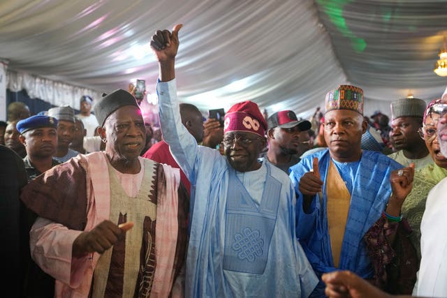 Bola Tinubu, centre, celebrates with supporters at the party’s campaign headquarters after winning the presidential elections 