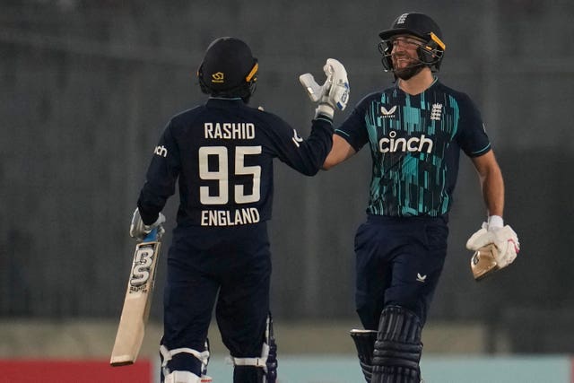 England’s Dawid Malan (right) and Adil Rashid celebrate victory