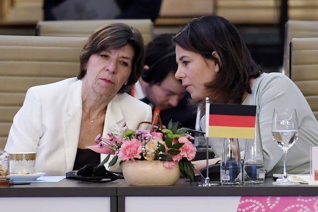 French Foreign and European Affairs Minister Catherine Colonna (L) talks with German Foreign Minister Annalena Baerbock during the G20 foreign ministers’ meeting 