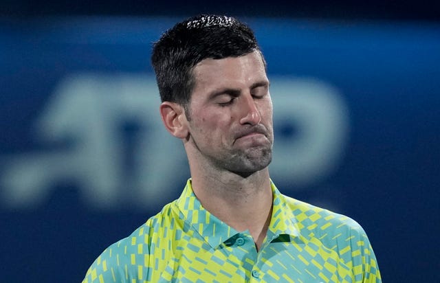 Novak Djokovic reacts to his defeat