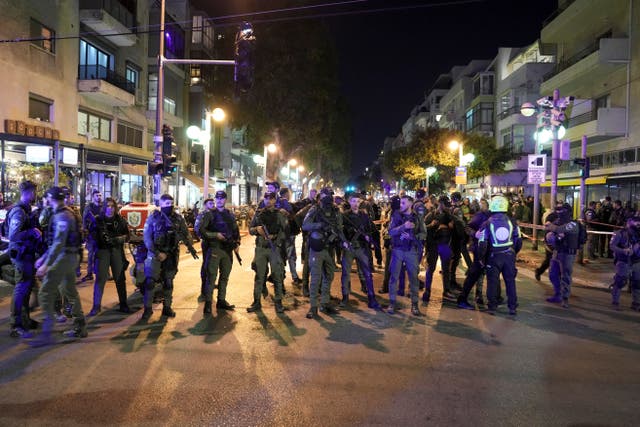 Israeli police block a shooting attack site in Tel Aviv