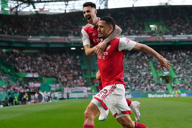 Arsenal's William Saliba, right, celebrates with team-mate Fabio Vieira 