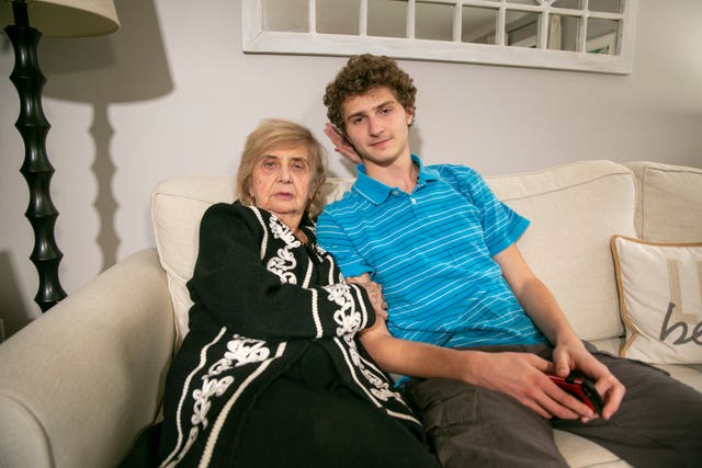 Holocaust survivor Tova Friedman, 85, with her grandson, 17-year-old Aron Goodman
