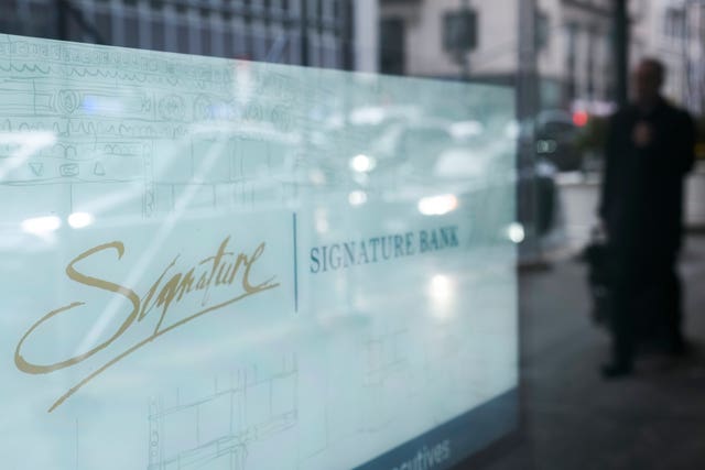 A sign is displayed at a branch of Signature Bank in New York 