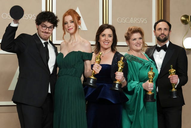 Daniel Roher, from left, Odessa Rae, Diane Becker, Melanie Miller and Shane Boris, winners of the award for best documentary feature film for Navalny, in the press room at the Oscars at the Dolby Theatre in Los Angeles
