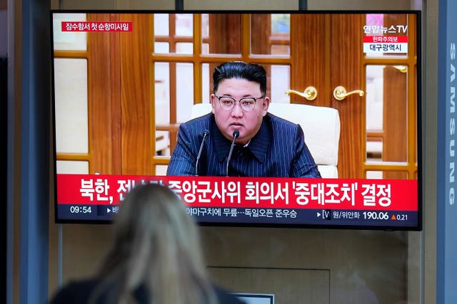 A TV screen shows an image of North Korean leader Kim Jong Un during a news programme 