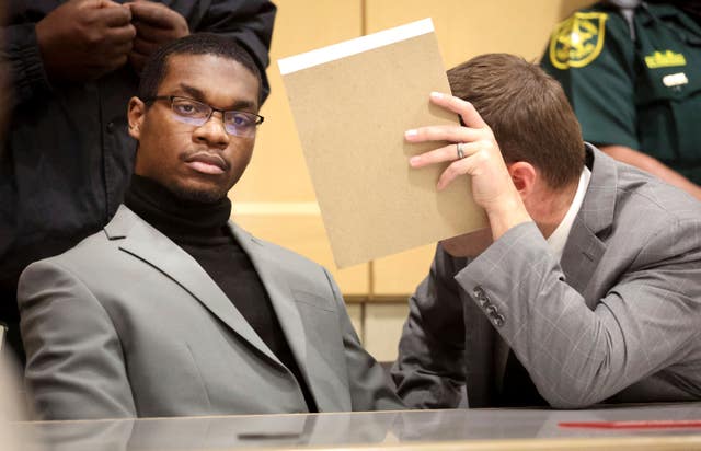 Michael Boatwright listens to his lawyer Joseph Kimok after he was found guilty of first-degree murder of emerging rapper XXXTentacion at the Broward County Courthouse in Fort Lauderdale