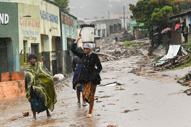 Women walk to a nearby displacement centre in Blantyre, Malawi