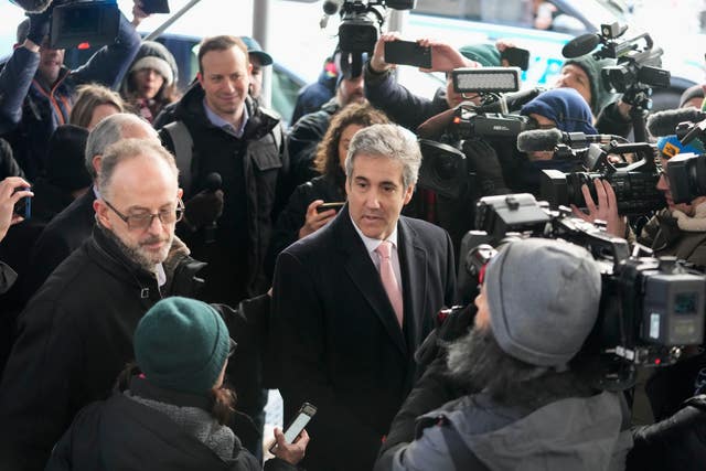 Donald Trump’s former lawyer Michael Cohen, centre, is surrounded by reporters as he arrives for a second day of evidence before a grand jury investigating hush money payments he arranged and made on the former president’s behalf