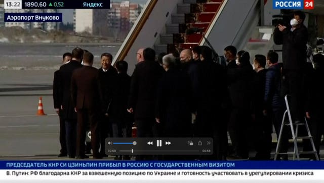 In this grab taken from video provided by RU-24, China’s President Xi Jinping disembarks his plane upon his arrival at the Vnukovo-2 government airport outside Moscow