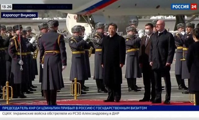 In this grab taken from video provided by RU-24, China’s President Xi Jinping stands, during an official welcome ceremony upon his arrival at the Vnukovo-2 government airport outside Moscow