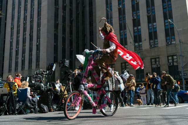 A Trump supporter takes part in a protest near the Manhattan District Attorney’s office on Tuesday 