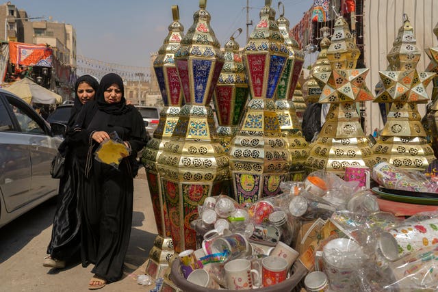 People buy traditional lanterns at the Sayyeda Zeinab market ahead of Ramadan in Cairo, Egypt