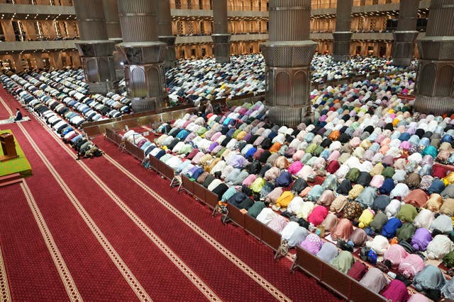 Indonesian Muslims perform a prayer marking the first eve of the holy fasting month of Ramadan at Istiqlal Mosque in Jakarta, Indonesia 
