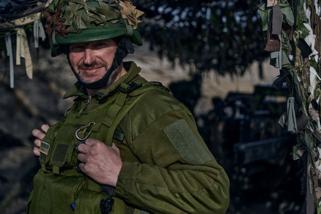 A Ukrainian soldier looks from their position on the frontline in Bakhmut