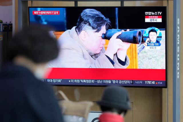 A TV screen shows an image of North Korean leader Kim Jong Un during a news programme at the Seoul Railway Station in South Korea