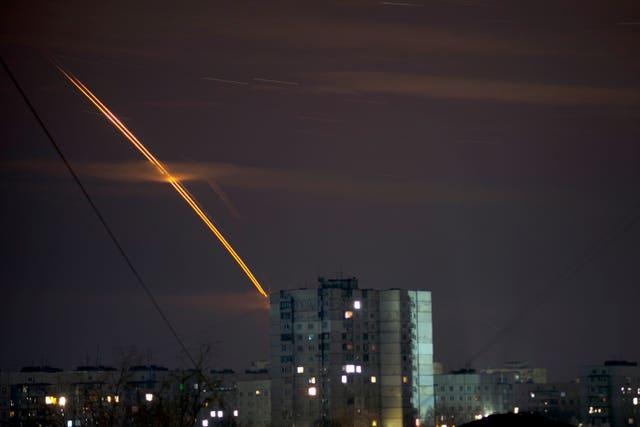 Russian rockets launched against Ukraine from Russia’s Belgorod region streak across the sky at dawn in Kharkiv