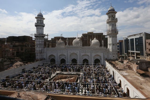 People perform mid-day prayer in the Mahabat Khan mosque on the first day of Ramadan, in Peshawar, Pakistan