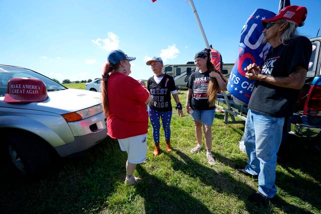 Supporters of Donald Trump gather near an airport in Waco ahead of the first rally of his 2024 campaign