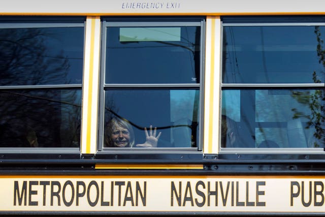A child weeps while on the bus leaving The Covenant School (Nicole Hester/The Tennessean/AP)