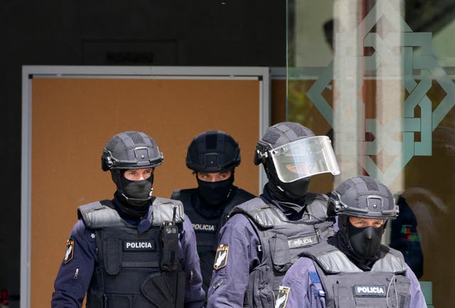 Police officers at the Ismaili Muslim centre in Lisbon following the incident 