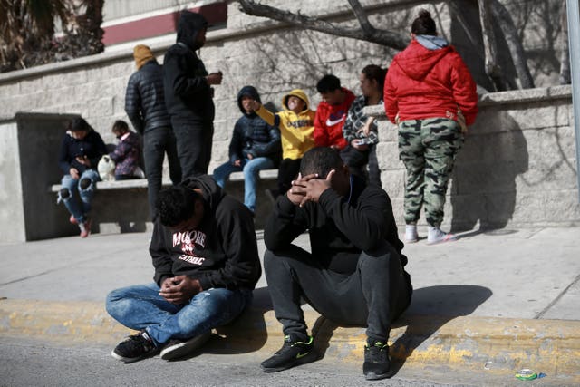 Migrants grieve outside the immigration detention centre 