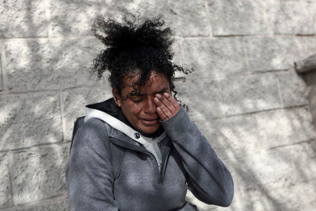 A Venezuelan migrant woman cries in front at of the immigration detention centre in Ciudad Juarez, Mexico 