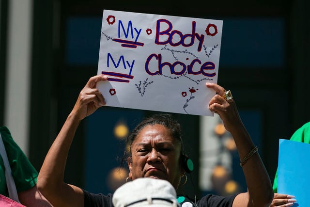 A small crowd gathers on the steps of the Capitol for a news conference to voice their opposition to the near total abortion ban bill being voted on by the Senate later this week Wednesday, March 29, 2023 in Tallahassee, Fla