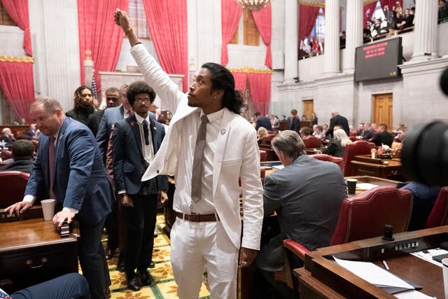 Justin Jones, D-Nashville, raises his fist on the floor of the House chamber as he walks to his desk to collect his belongings after being expelled from the legislature on Thursday, April 6, 2023, in Nashville, Tenn
