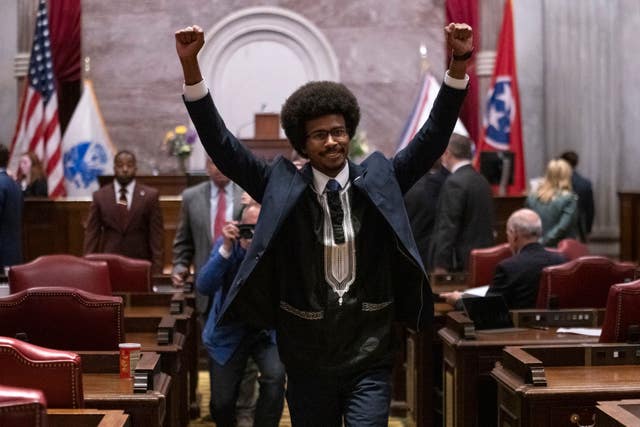 Justin Pearson raises his fists as he leaves the House chamber after he was expelled from the legislature on Thursday, April 6, 2023, in Nashville, Tenn