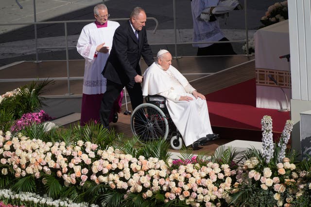 Pope Francis arrives in a wheelchair in St Peter’s Square at the Vatican to celebrate the Easter Sunday Mass