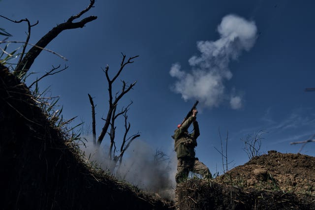 Ukrainian soldier fires grenade