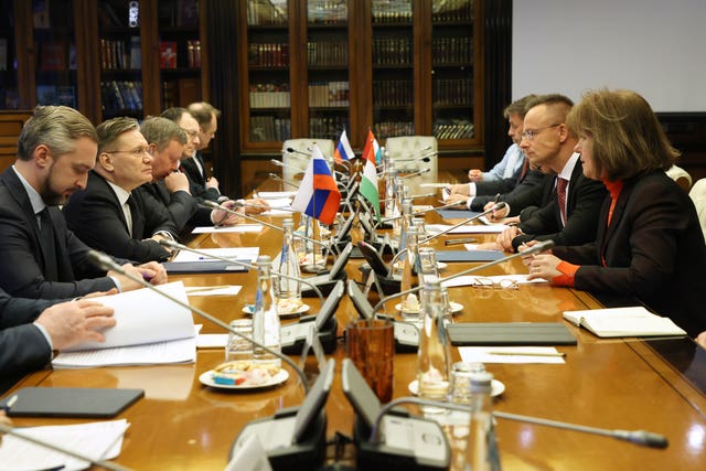 Alexey Likhachev, director general of state atomiс energy corporation Rosatom, second left, and Peter Szijjarto, minister of foreign affairs and trade of Hungary, second right, talk during their meeting in Moscow