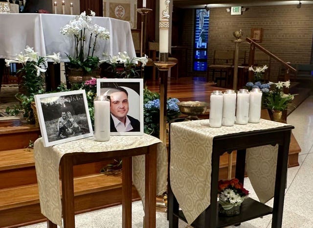 A memorial for Joshua Barrick on display at Holy Trinity Catholic Church in Louisville