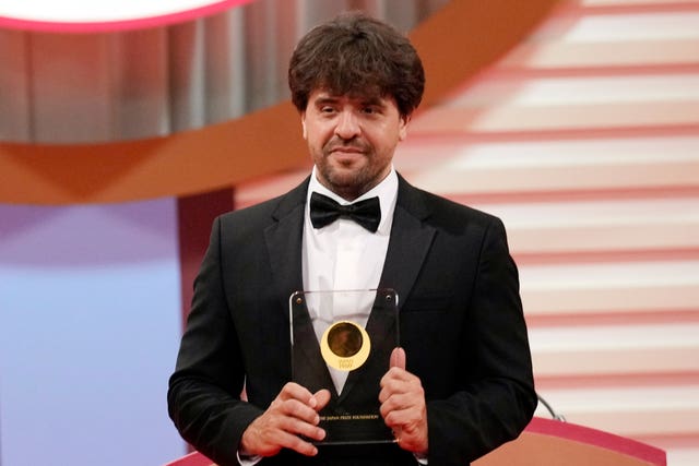 US scientist Karl Deisseroth holding an award
