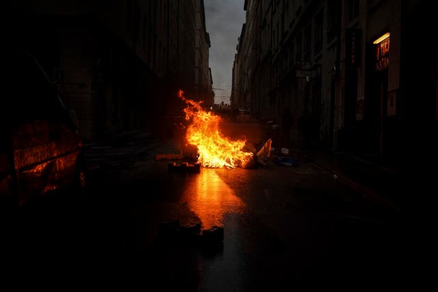 A barricade burns during a protest in Lyon, central France, on Friday