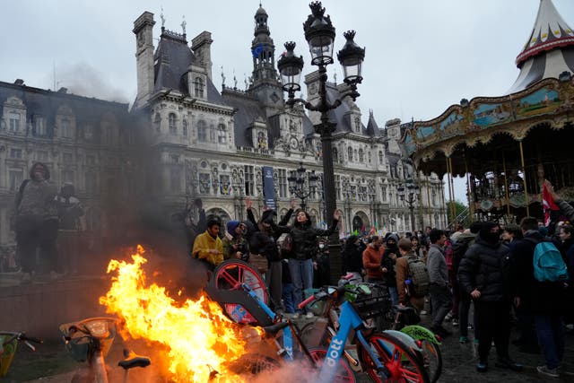 Bicycles burn during a protest outside Paris City Hall on Friday