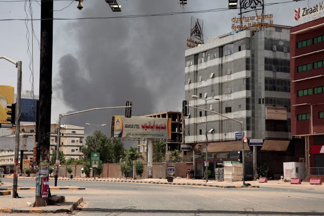 Smoke is seen rising from a neighbourhood in Khartoum, Sudan 