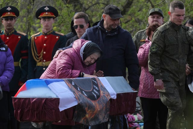 Family mourns at a graveside