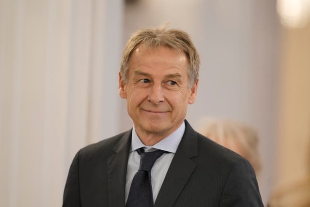 German former football player and national team coach Juergen Klinsmann arrives for a reception to honour former chancellor Angela Merkel with the Grand Cross of the Order of Merit of the Federal Republic of Germany in a special design at Bellevue Palace in Berlin, Germany